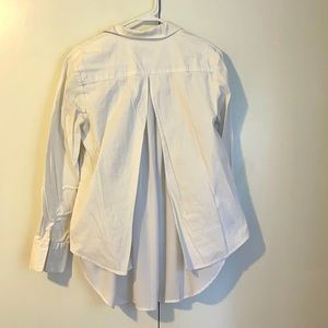 High low white blouse with satin back detail! Long sleeve